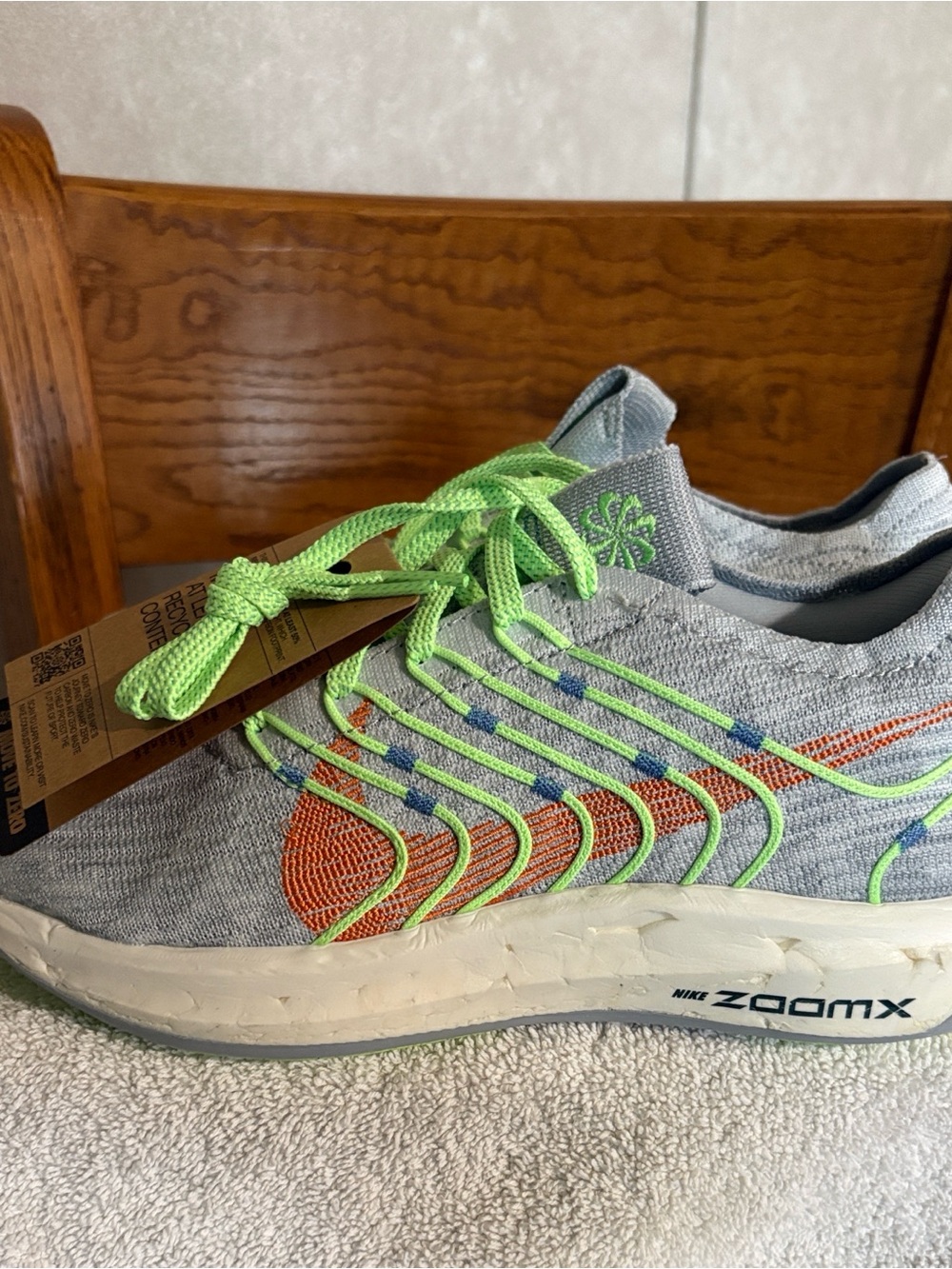 Women’s Nike Gray Knit Running Shoe with Neon Green Laces and Orange Swoosh